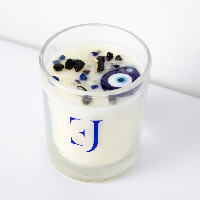 Evil Eye Geurkaars in glas, gevuld met sojawas en edelstenen voor bescherming en positieve energie.