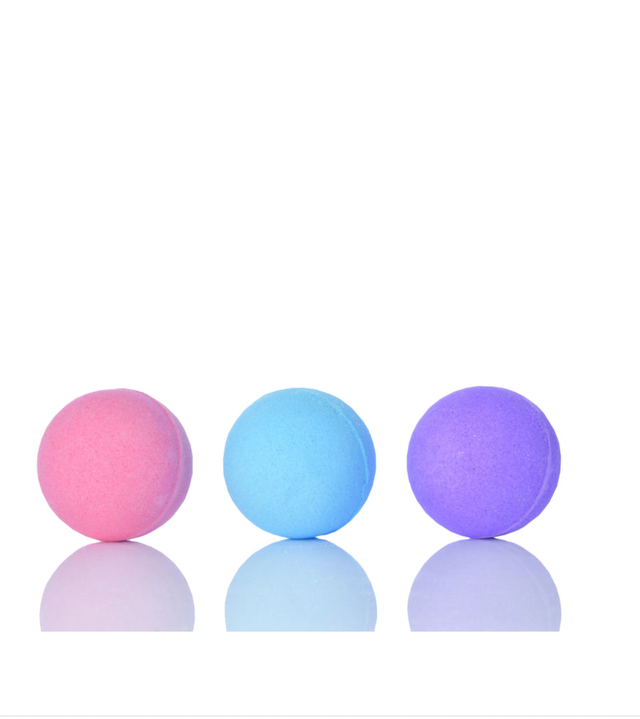 Colorful Miss Nella bath bombs in pink, blue, and purple, perfect for kids' bath time fun.
