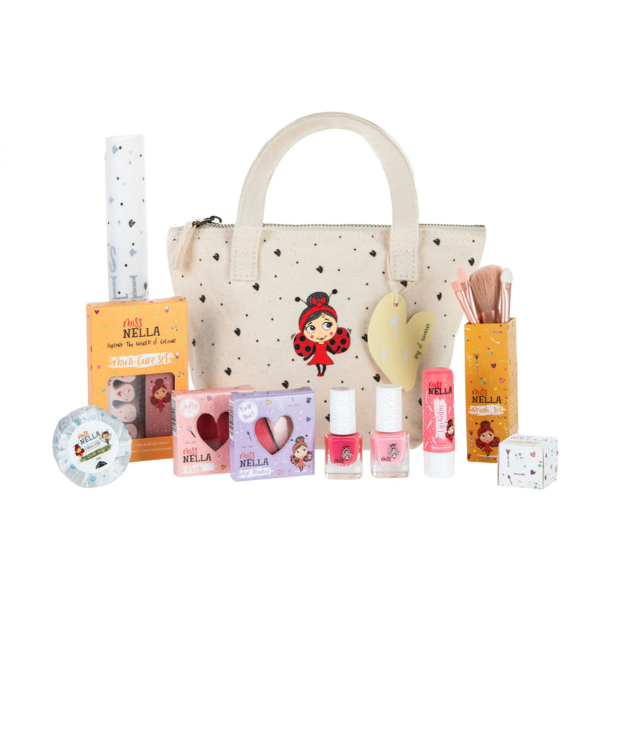 Canvas Bag of Wonders with kids' safe cosmetics including nail polish, soap, blush, and brush set.